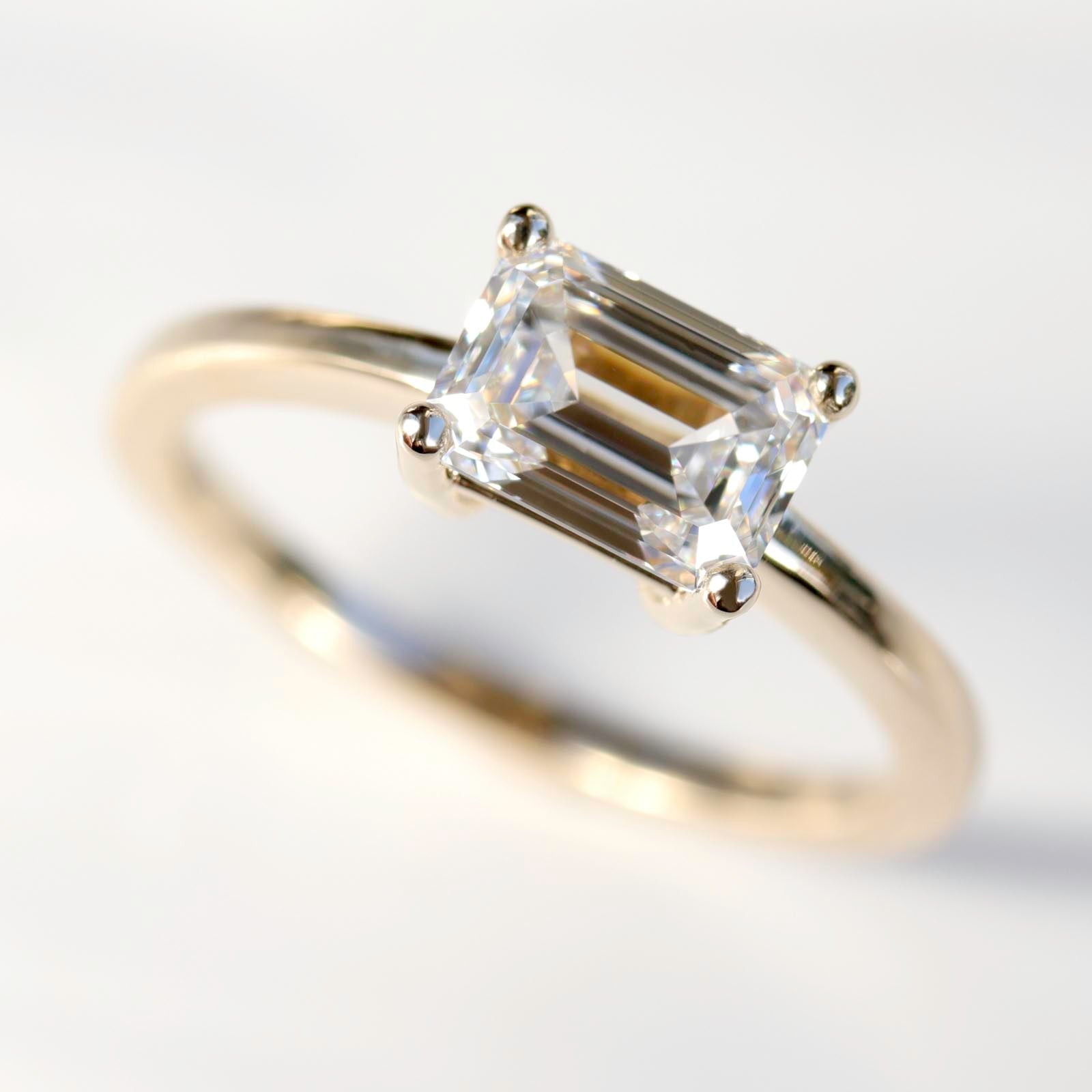 Emerald-cut East-West Basket Solitaire Engagement Ring